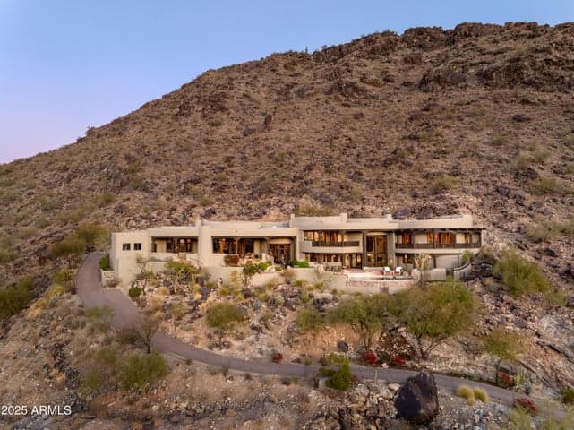 Designed to harmonize with its mountainous surroundings, this stunning hilltop estate offers striking views, spacious outdoor living areas, and architectural sophistication. A rare opportunity to own an iconic property that fuses desert serenity with high-end finishes and modern comfort.