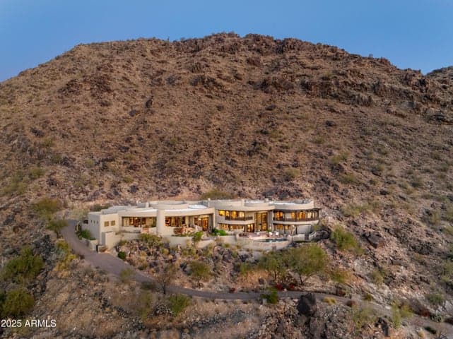 This is your exclusive invitation to explore an architecturally captivating estate nestled high above Paradise Valley. Set within a gated enclave, this residence delivers privacy, luxury, and unmatched desert scenery. With premium finishes and breathtaking views throughout, it’s a must-see home for discerning buyers.