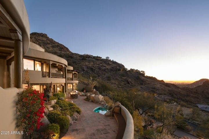 Wake up to sweeping southern views of the Sonoran Desert and surrounding mountains. This elevated patio captures the vast beauty of Paradise Valley, with complete privacy and endless sky.
