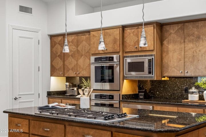 Appliances Include: Thermador Gas Cooktop, Dual Thermador Ovens, DCS Warmer Drawer, Microwave, Three Dishwashers, SubZero Fridge/Freezer