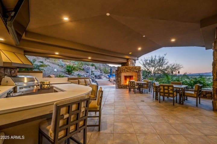 Features Include: Two Separate BBQ Areas w/ Sinks, Outdoor Fireplace, Outdoor Firepit, Misters, Outdoor TV, Outdoor Sound System