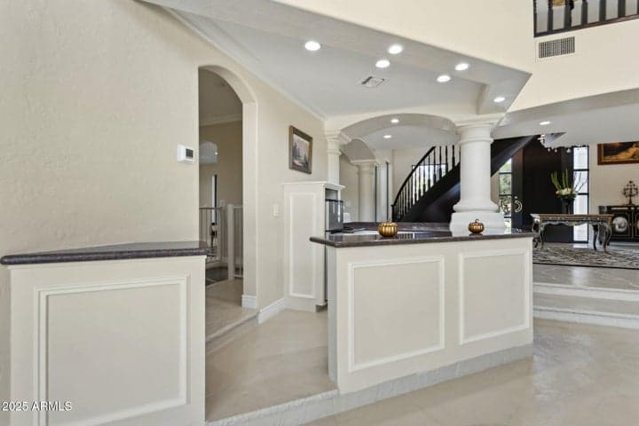 Living room, wet bar/entrance to home theatre