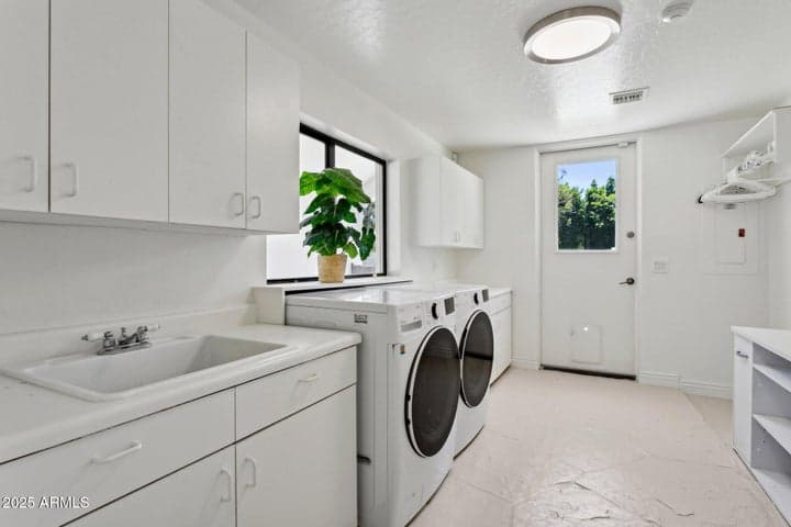 laundry room with sunny window & outside door