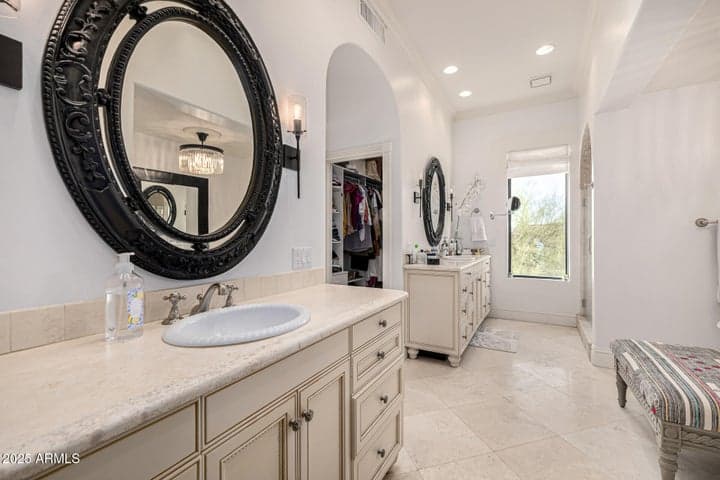 primary suite with his and hers closet