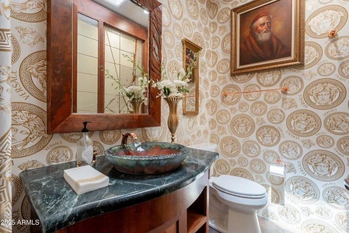 Stone vessel sink and custom cabinetry