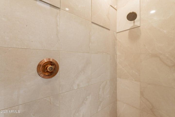 Floor-to-ceiling tile in walk-in shower