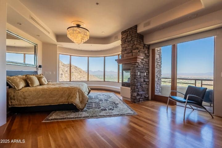 Spacious primary bedroom with north, east and south facing views