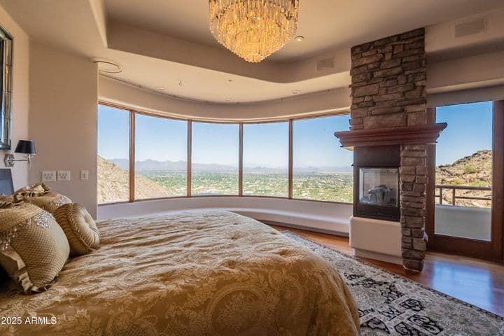 Built-in bench seating and two sided gas fireplace with private balcony access