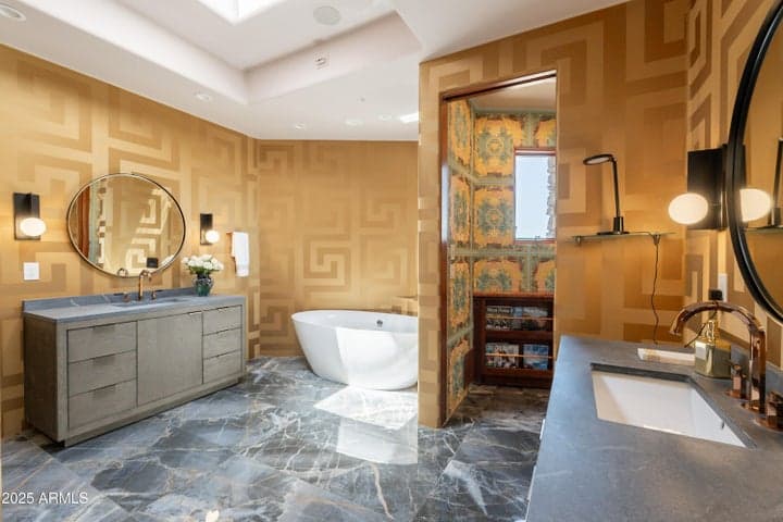 Stand alone soaking tub, separate vanities, stunning floors, Versace wallpaper and private water closet