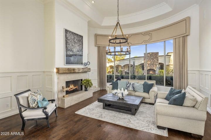 Formal living area overlooking spectacular pool/spa oasis