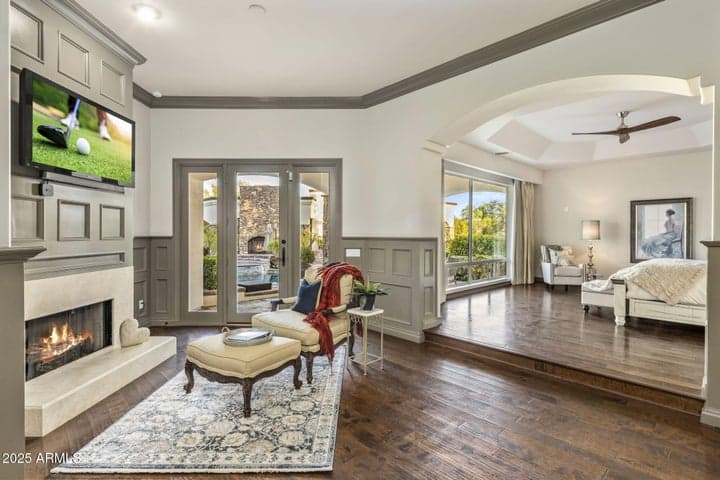 Primary suite sitting area with accents of custom millwork