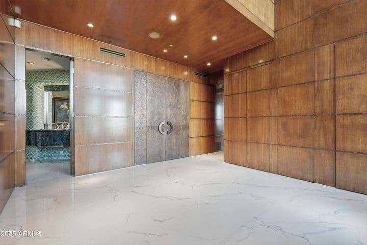 Home theater entry with adjacent powder room