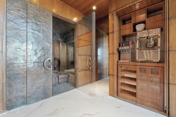 Hide all the goodies behind mahogany retractable cabinet doors