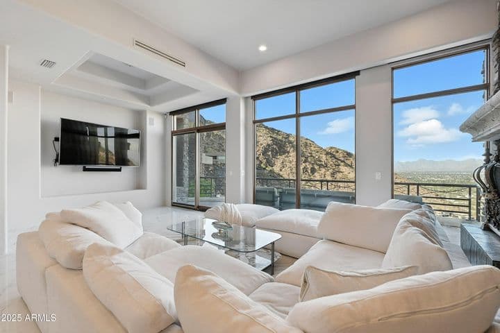 Floor-to-ceiling windows with slider to balcony. Dining space currently functions as media center