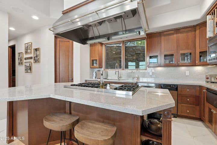 Custom cabinets, view window over deep double sink and walk-in pantry