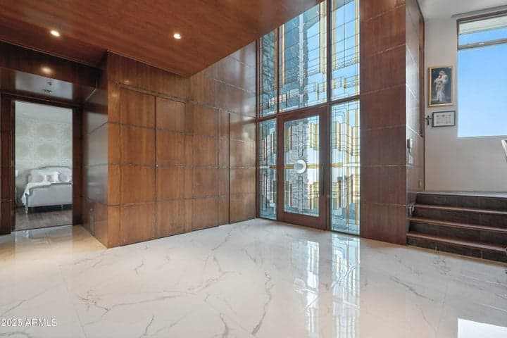 Two-story wall of stained and leaded glass for grand entry